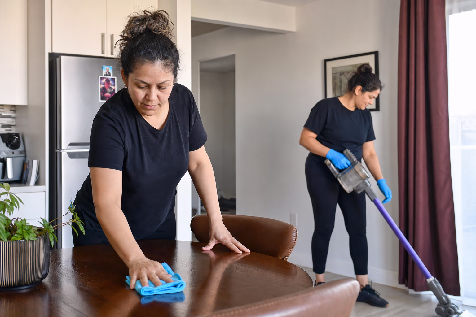 Two cleaners working during a recurring home visit